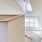 a room with a staircase and a window