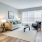 a living room with a couch and chairs