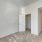 a carpeted room with white doors