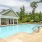 a swimming pool in front of a house