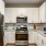 a kitchen with white cabinets