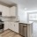 a kitchen with white cabinets
