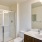 bathroom with toilet and walk in shower