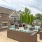 a patio with a couch and chairs