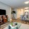 a living room with a tv and couches