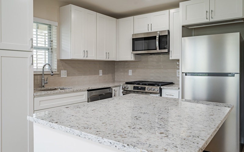 kitchen with white cabinets and quartz countertops