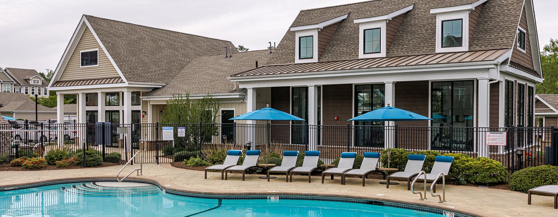 pool behind a clubhouse
